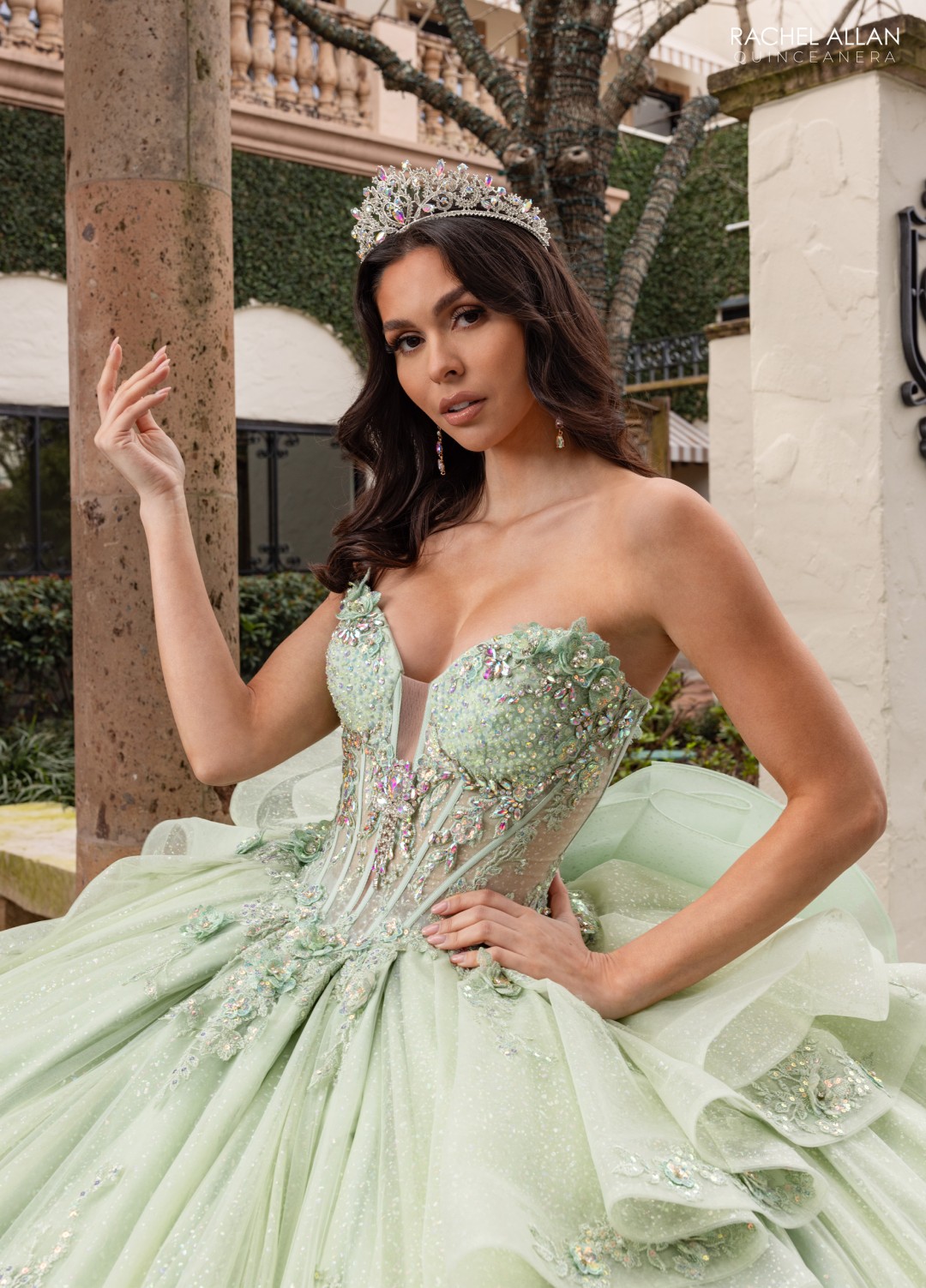 Green La Reina Quinceañera gown with gemstone corset and ruffled ball skirt